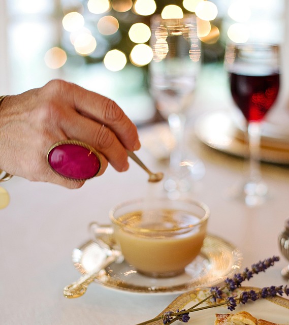 After dinner coffee blend organic bag with dark elegant labelling on a dining table with candles and a dark chocolate bar in ambient evening light